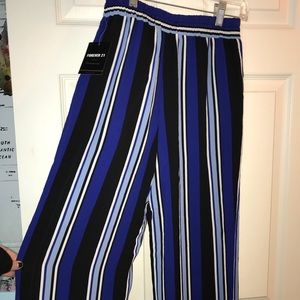 Striped blue, black, and white wide-leg pants